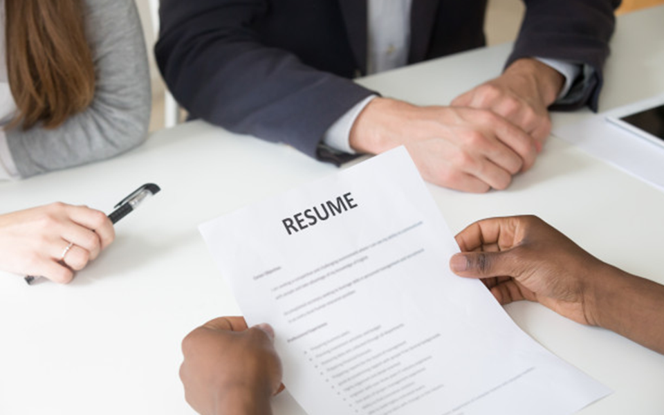 Resume submission moment during a college application process, illustrating the power of a strong resume – The Red Pen