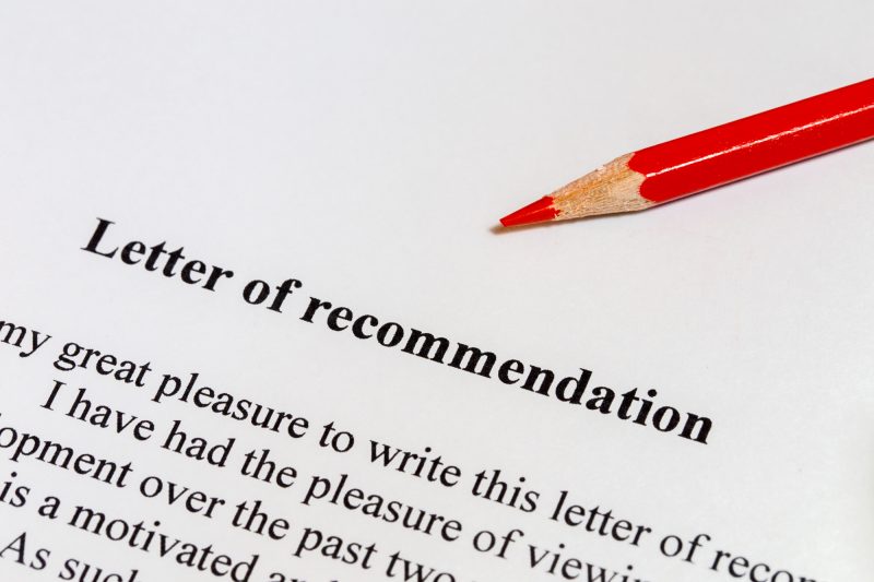 Red pencil lying on a recommendation letter, symbolizing the importance of early preparation - The Red Pen