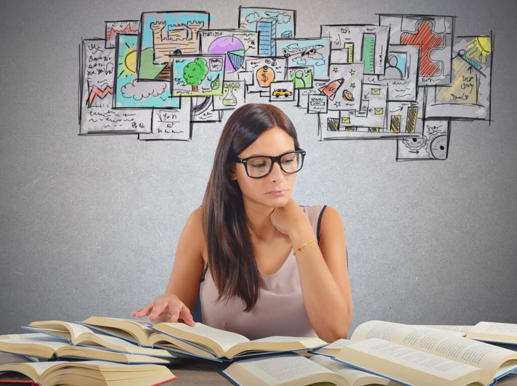 Scholar contemplating research approaches with visual brainstorming, learn with The Red Pen