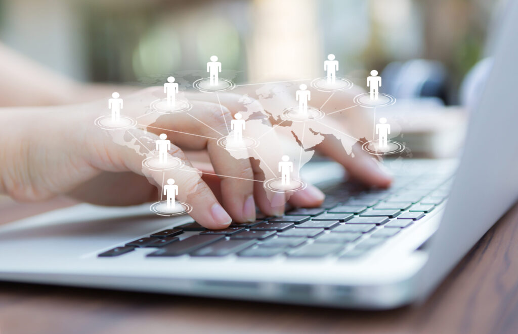 Global network connection with a laptop in use and connected individuals icons – Shortlisting US Colleges? Don’t Miss These 6 Key Factors Beyond Rankings | The Red Pen
