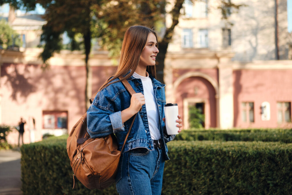 Undergraduate student walking on a university campus, preparing for an international study journey – The Red Pen