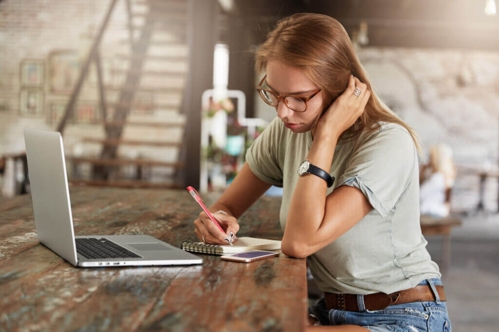 Casual young learner using online resources to navigate UCAS admissions in the UK by The Red Pen