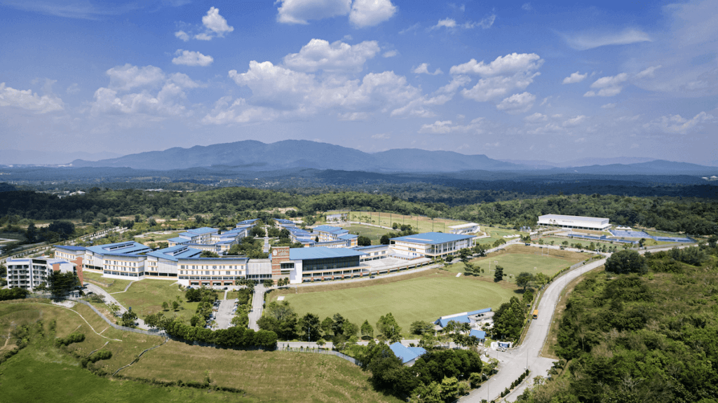Aerial shot of Epsom College Malaysia, illustrating its expansive grounds and excellent educational facilities - The Red Pen